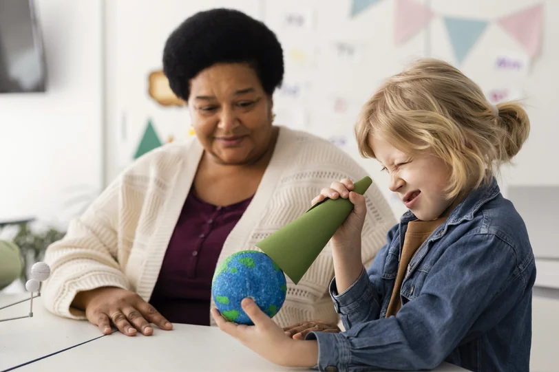 A social worker and a child playing together