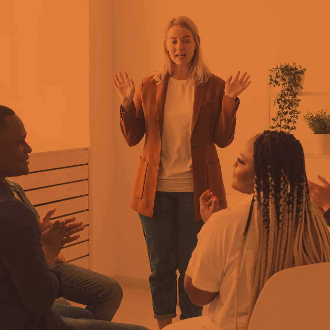 A presenter speaking to a small group