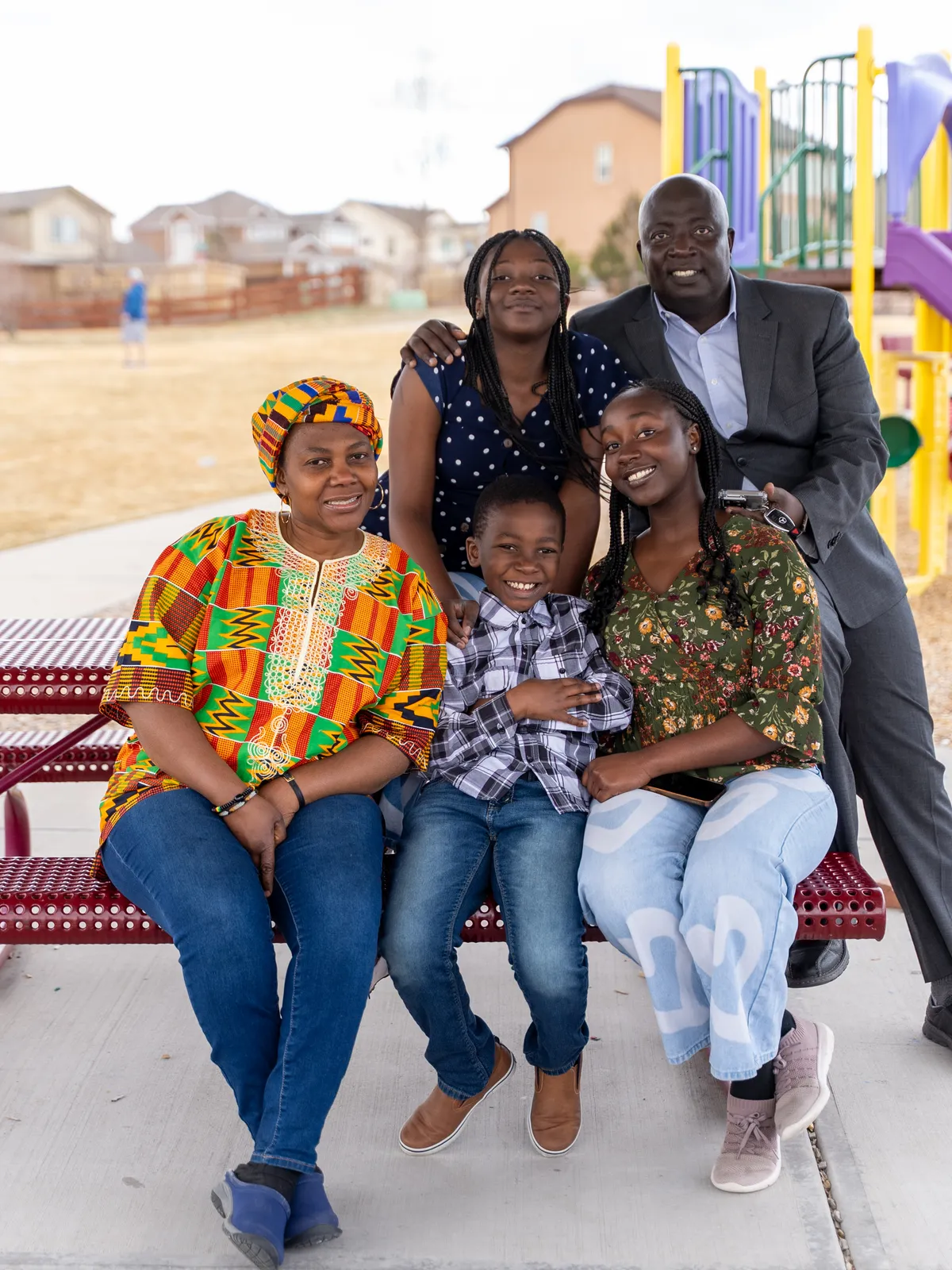 A foster family together outdoors